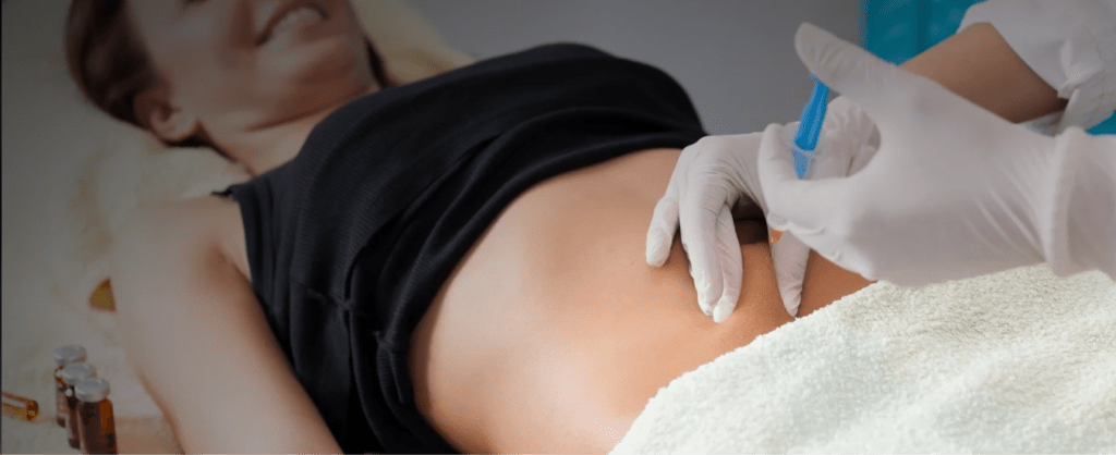 A woman receiving a fat reduction injection on her abdomen.