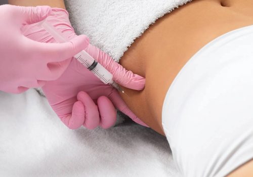 Body sculpting injection being administered to the abdomen.