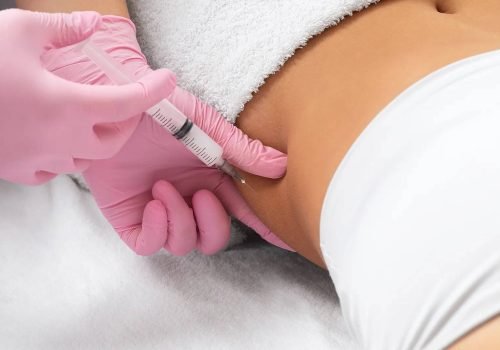 Body sculpting injection being administered to the abdomen.